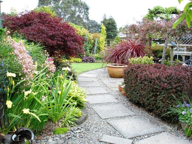 The promise of a journey is possible even on very small sites like in the town garden of Thorveton