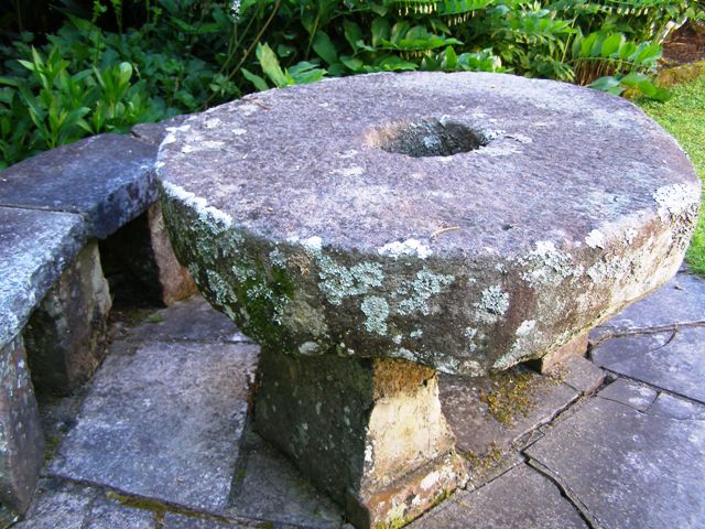 The antique stone mill wheels are fine as garden decoration